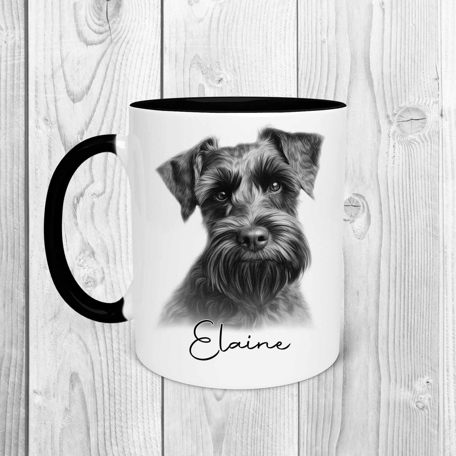 A white mug with a black handle and a black inside.  Image printed on the front of the mug is a sketch of a schnauzer with the name Elaine written underneath in black text.